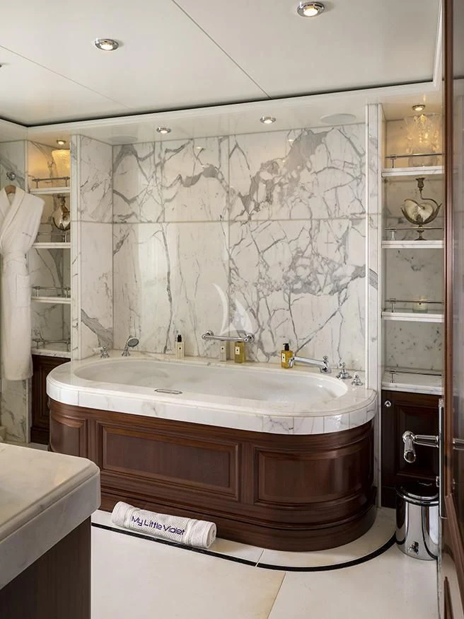a bathroom with a large shower curtain aboard MY LITTLE VIOLET Yacht for Sale