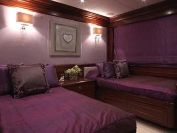 a couple of beds in a hotel room aboard MY LITTLE VIOLET Yacht for Sale