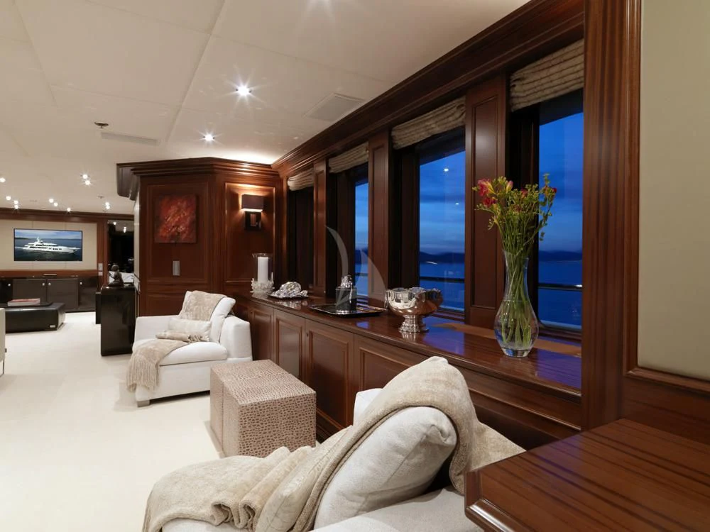a living room with a large mirror aboard MY LITTLE VIOLET Yacht for Sale