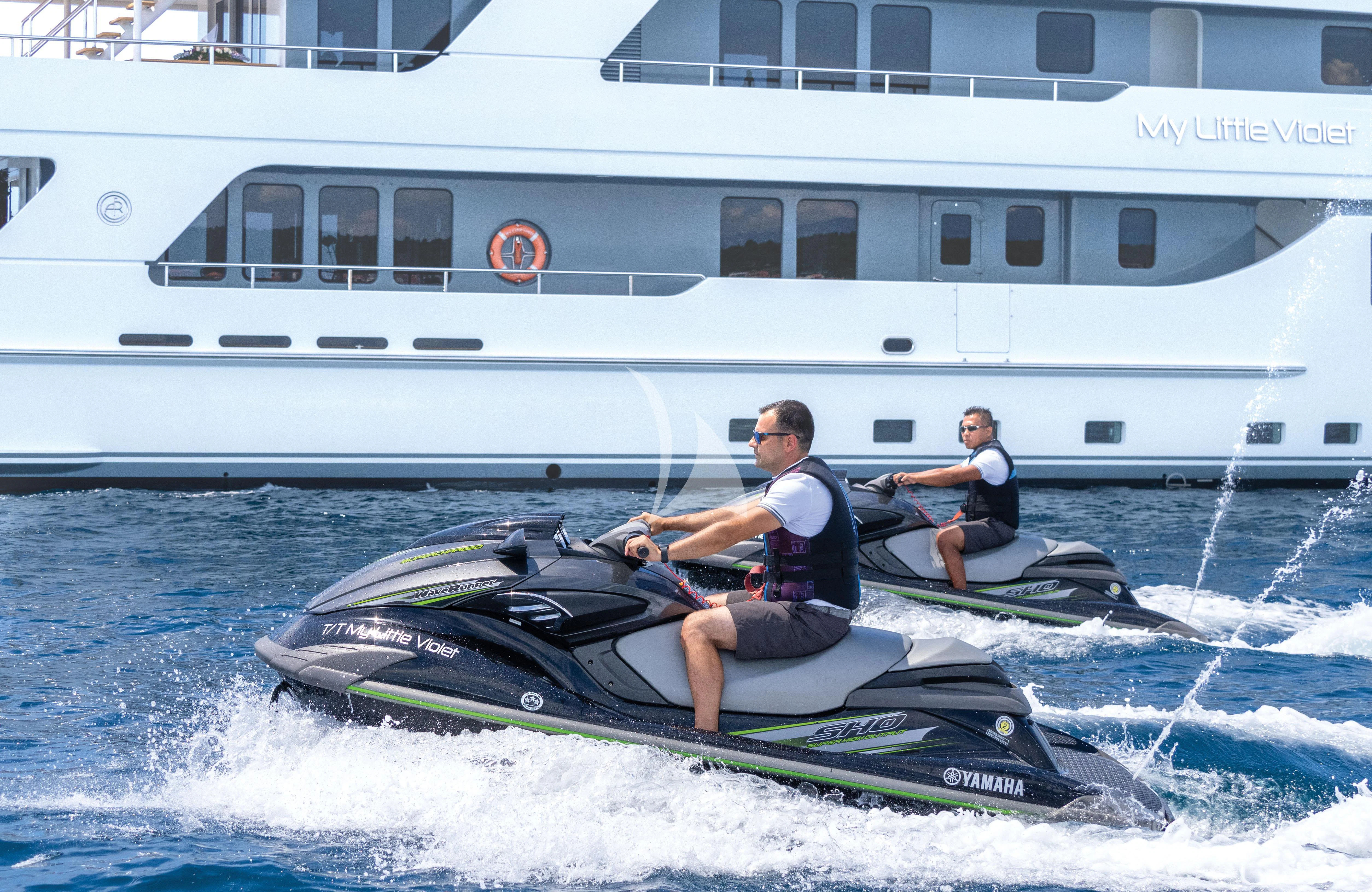 two men in a speedboat aboard MY LITTLE VIOLET Yacht for Sale