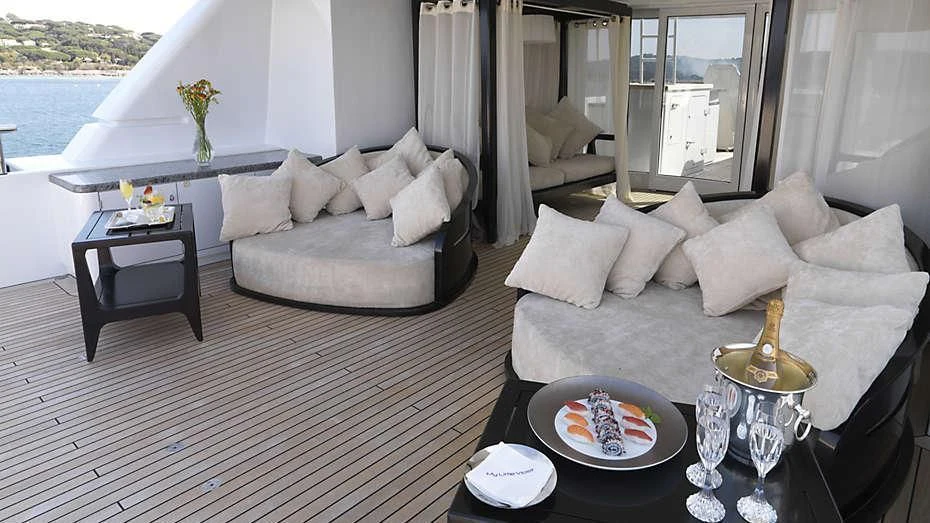 a living room with a couch and a table aboard MY LITTLE VIOLET Yacht for Sale