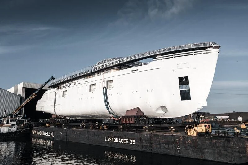 a large white boat docked aboard PROMISE.D Yacht for Sale