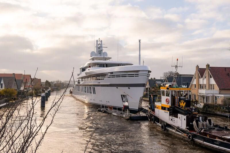 a large white boat sits in a canal aboard PROMISE.D Yacht for Sale