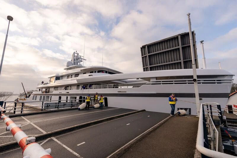 a large white ship docked aboard PROMISE.D Yacht for Sale