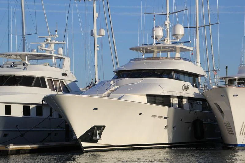 several boats parked in a harbor aboard BESS TIMES Yacht for Sale