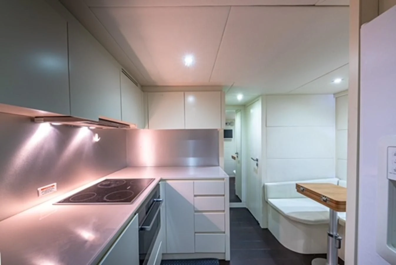 a kitchen with pink cabinets aboard WRAITH Yacht for Sale