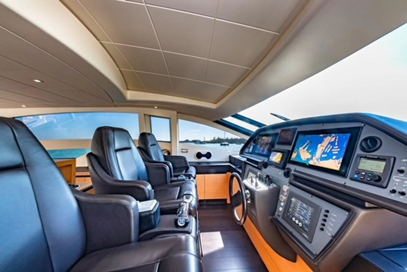 inside of a vehicle with seats and a screen on the back aboard WRAITH Yacht for Sale