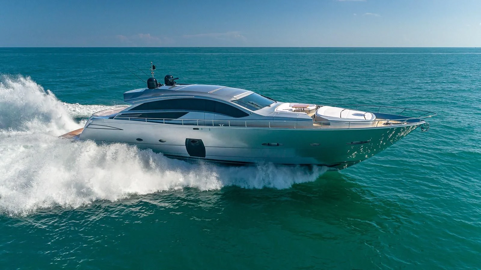a white yacht in the ocean aboard WRAITH Yacht for Sale