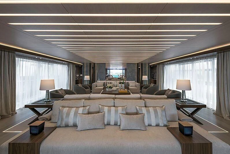 a large living room with a large window aboard UTOPIA IV Yacht for Sale