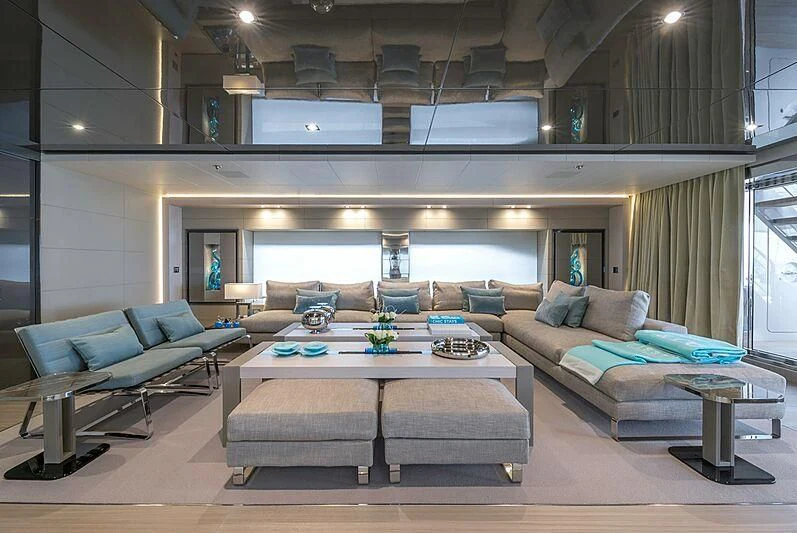 a living room with a couch and a table aboard UTOPIA IV Yacht for Sale