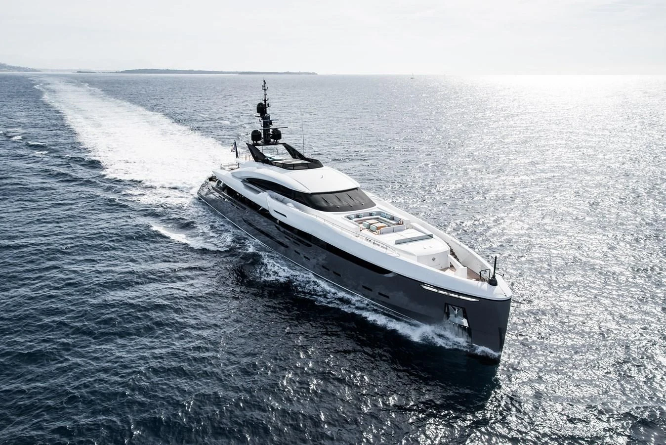 a white yacht in the water aboard UTOPIA IV Yacht for Sale