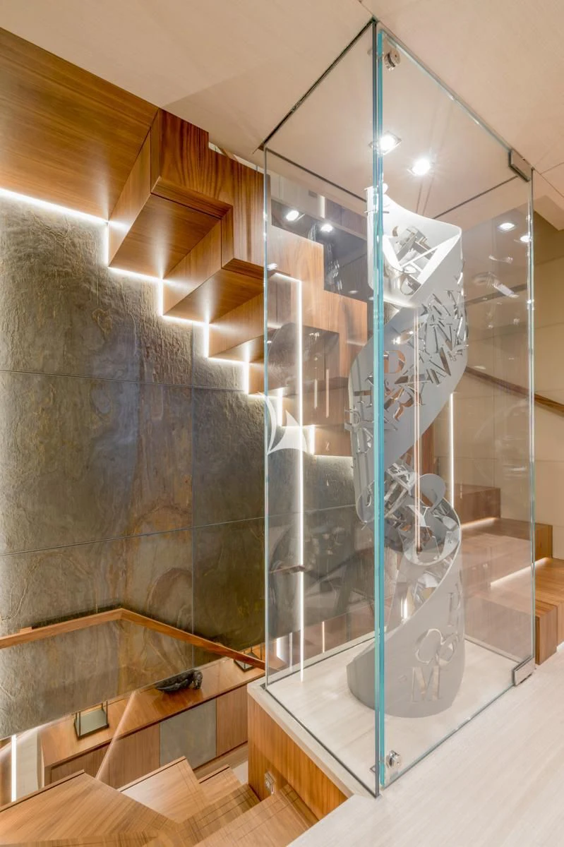 a glass wall with a glass display aboard UTOPIA IV Yacht for Sale