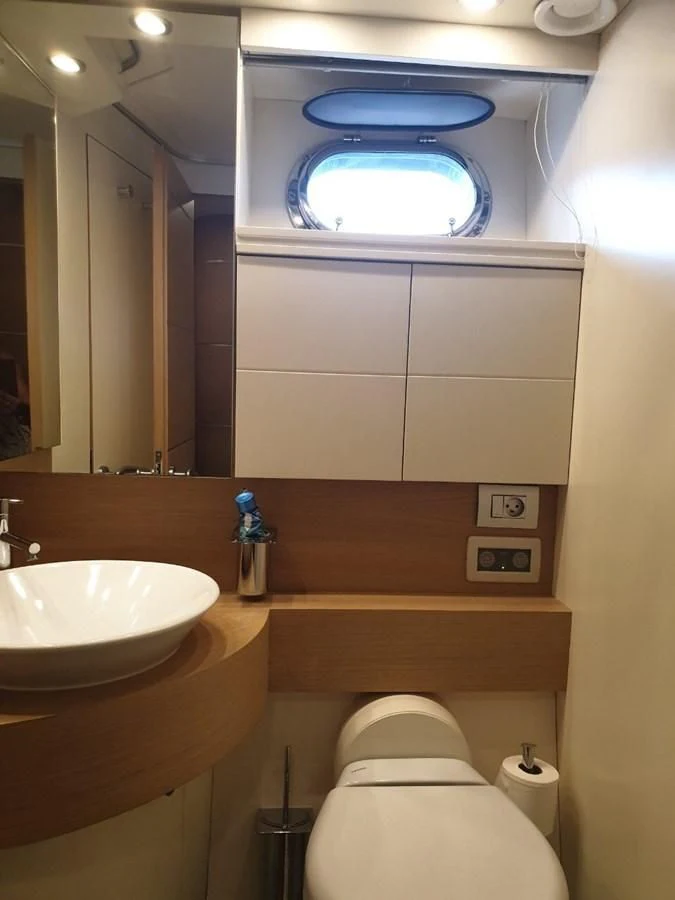 a bathroom with a sink and a toilet aboard FOX Yacht for Sale