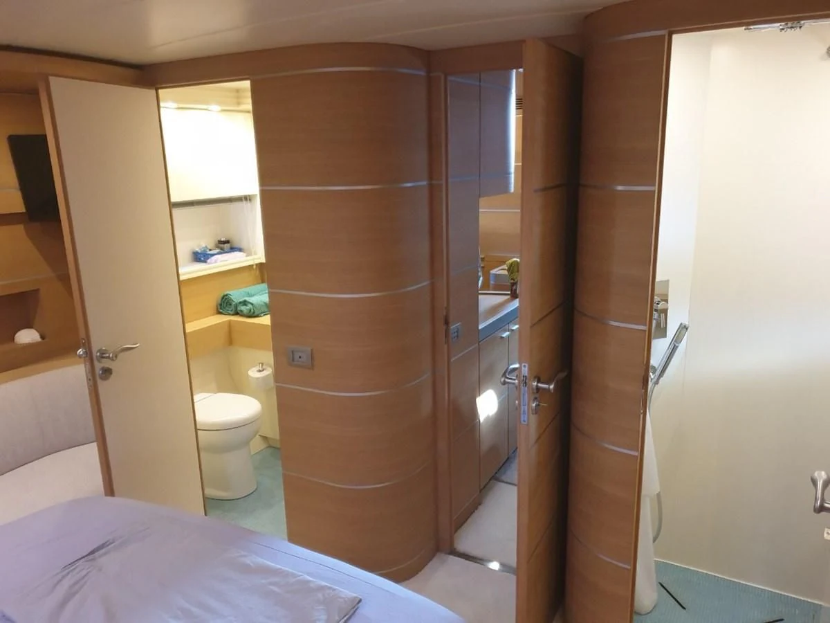 a bathroom with a glass shower aboard FOX Yacht for Sale