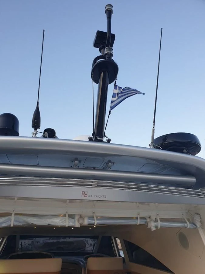 a military vehicle with a flag on top aboard FOX Yacht for Sale