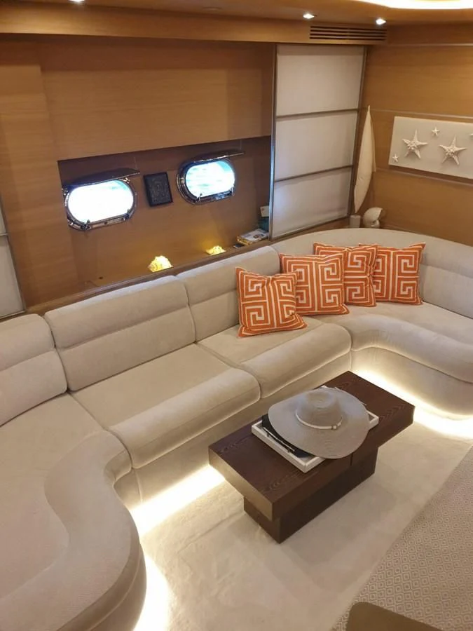 a couch with a coffee table aboard FOX Yacht for Sale