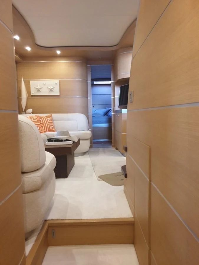a room with a bed and a couch aboard FOX Yacht for Sale