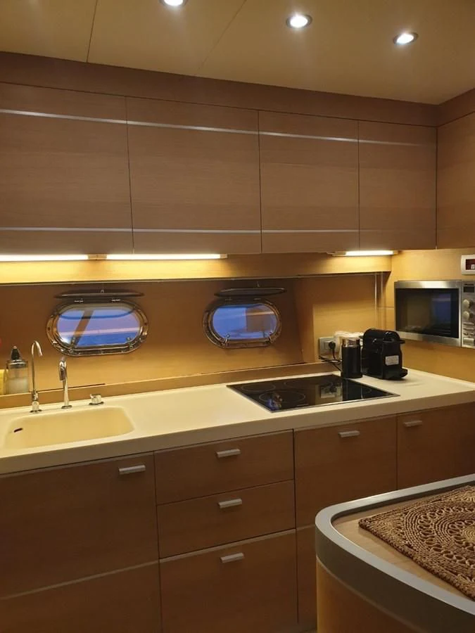 a kitchen with a sink and a microwave aboard FOX Yacht for Sale