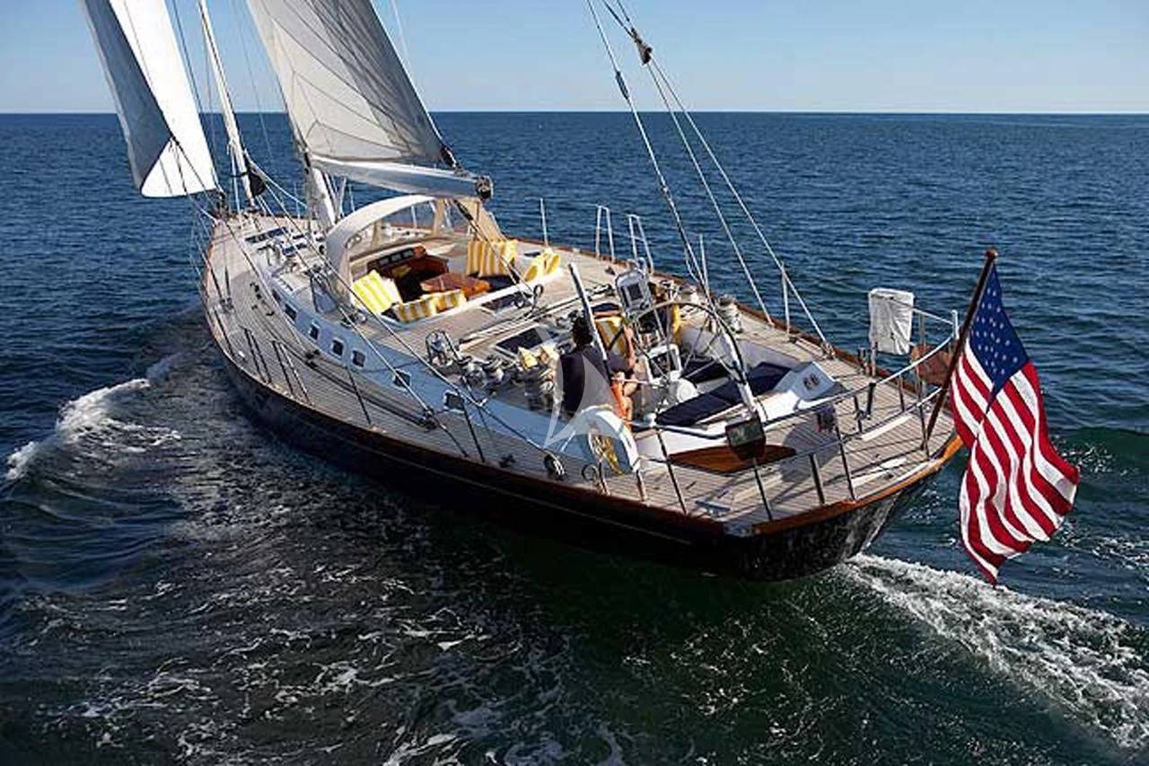 a boat with a flag on the front aboard LUNA DANNS Yacht for Sale