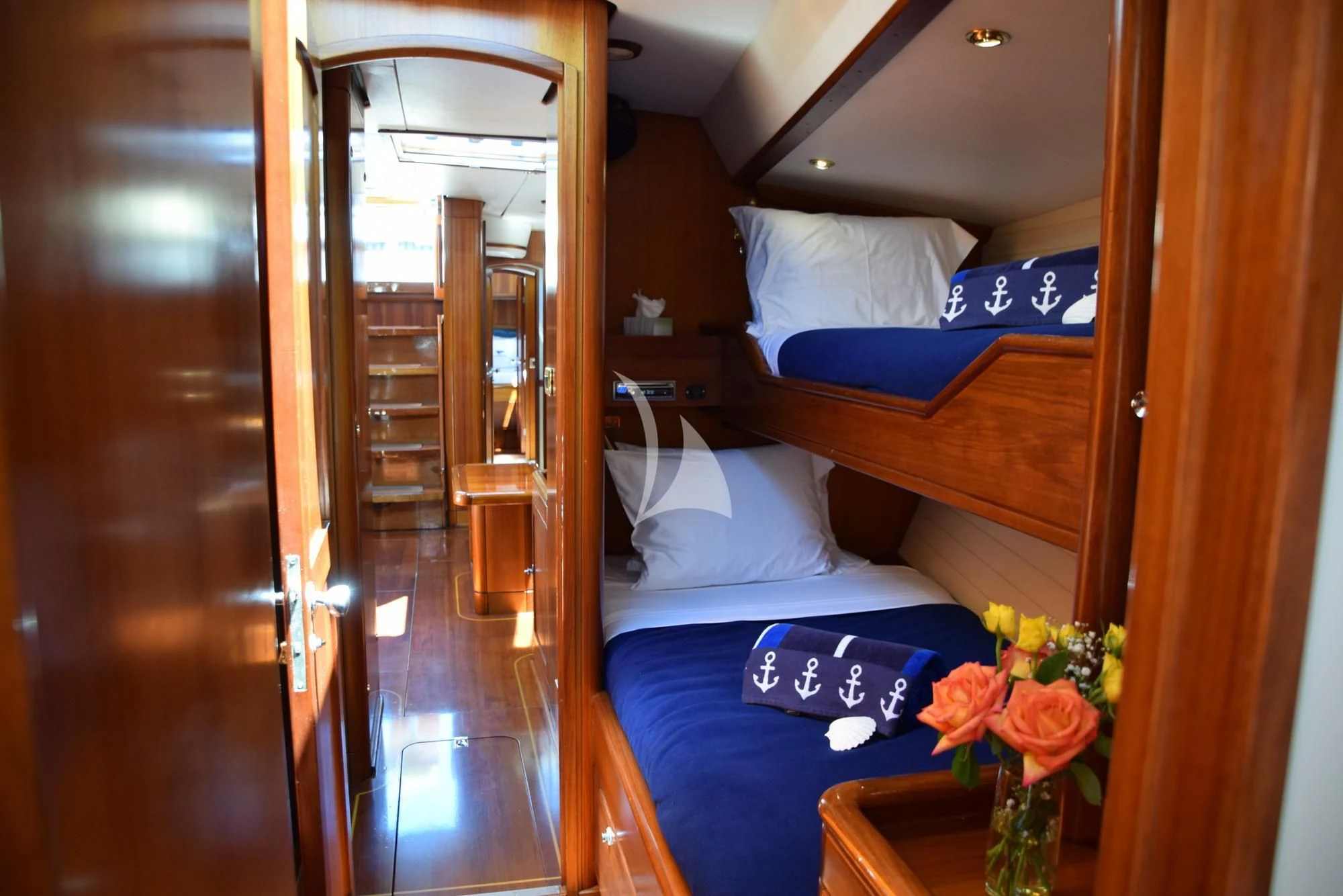 a room with a bed and a door aboard LUNA DANNS Yacht for Sale