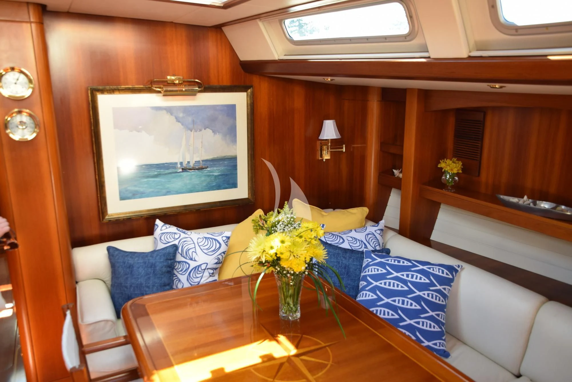 a living room with a large screen aboard LUNA DANNS Yacht for Sale