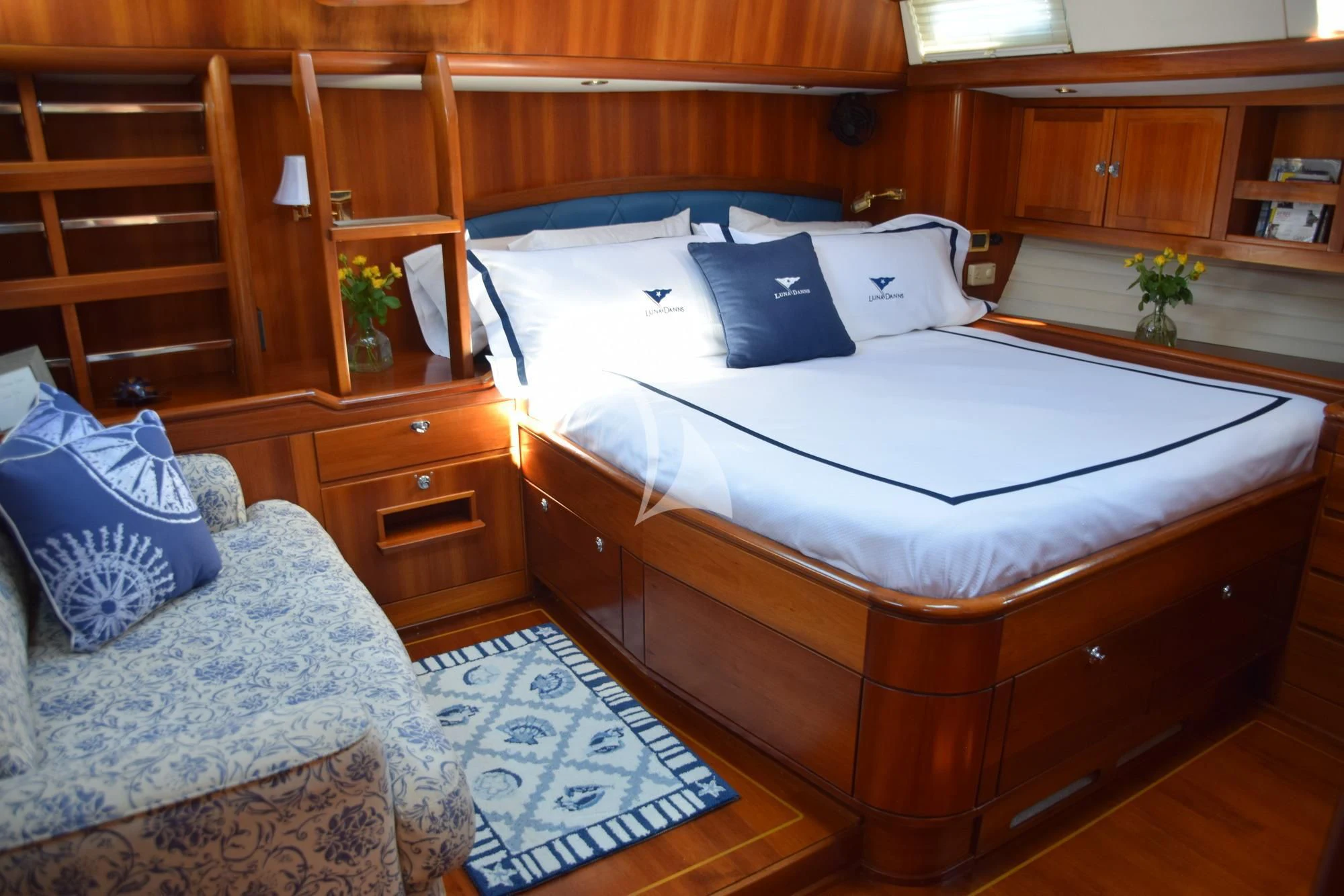 a bed with white sheets and pillows aboard LUNA DANNS Yacht for Sale