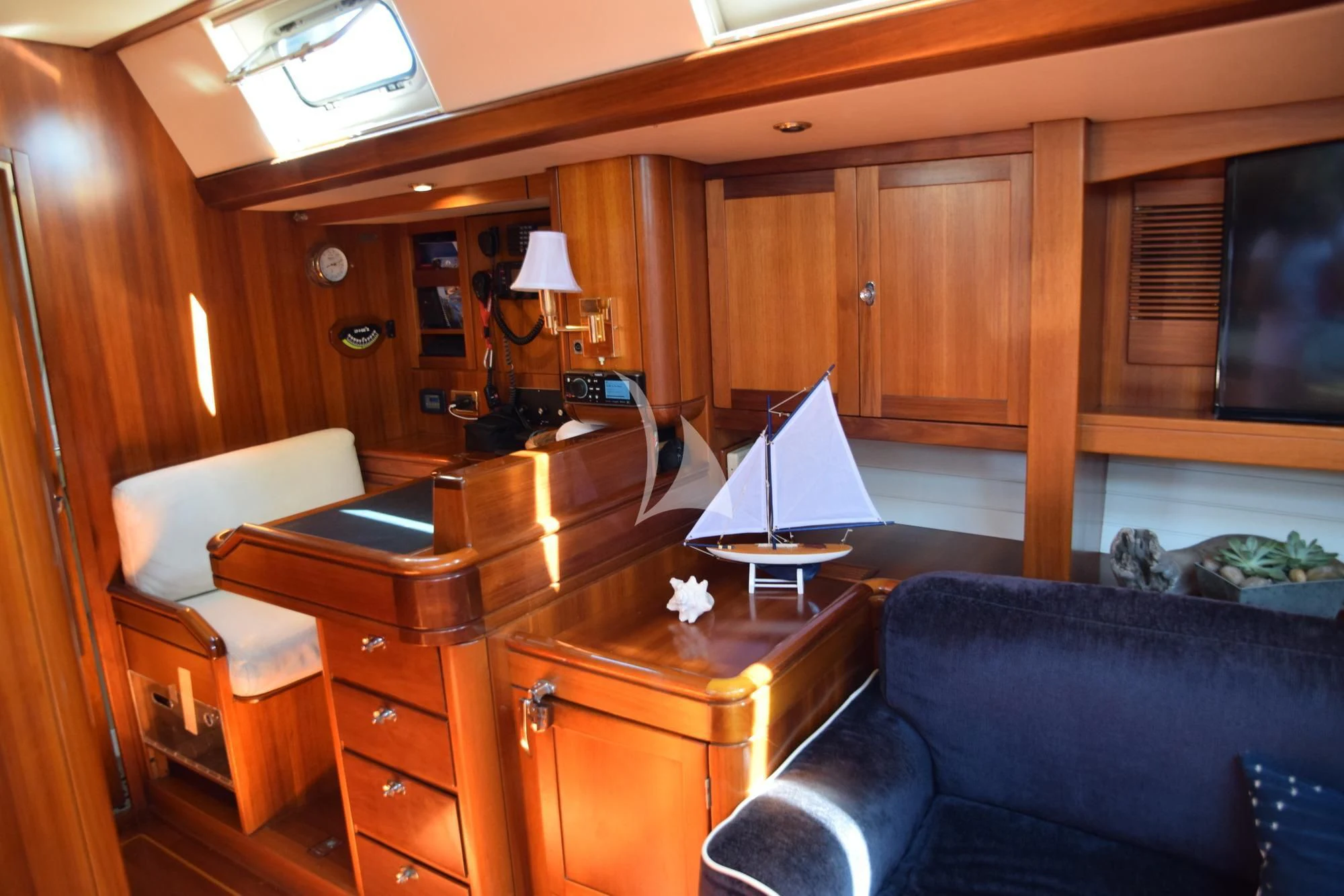 a living room with a computer and a piano aboard LUNA DANNS Yacht for Sale