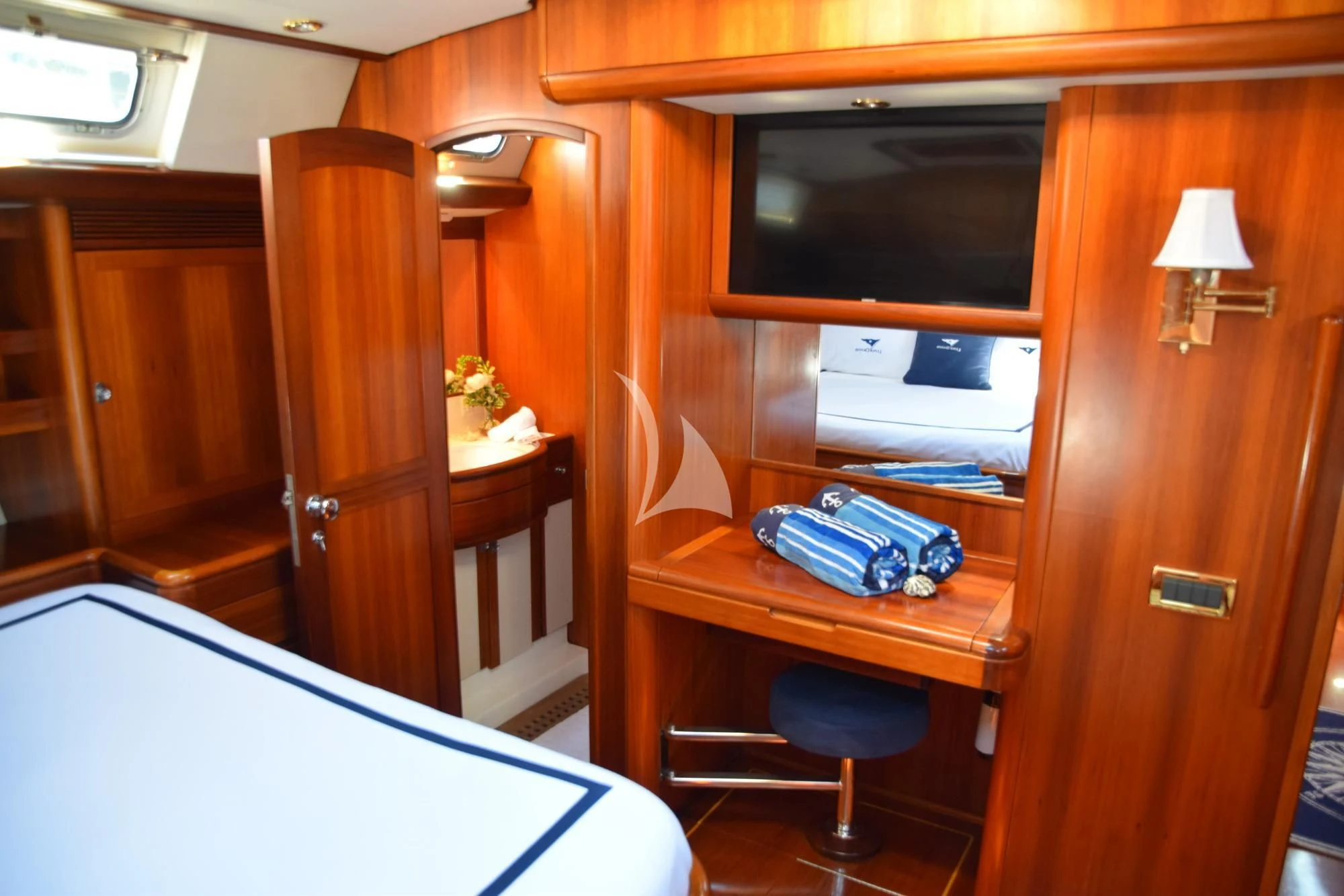 a room with a television and a desk aboard LUNA DANNS Yacht for Sale