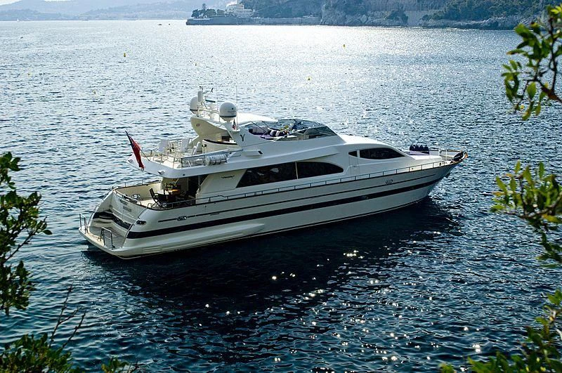 a white boat in the water aboard IMPORTANT BUSINESS Yacht for Sale
