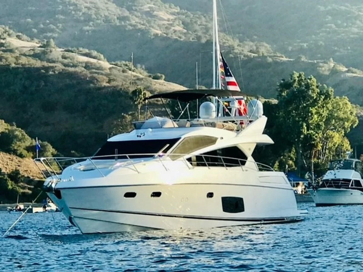a white yacht in the water aboard MOONLIGHT DRIVE Yacht for Sale