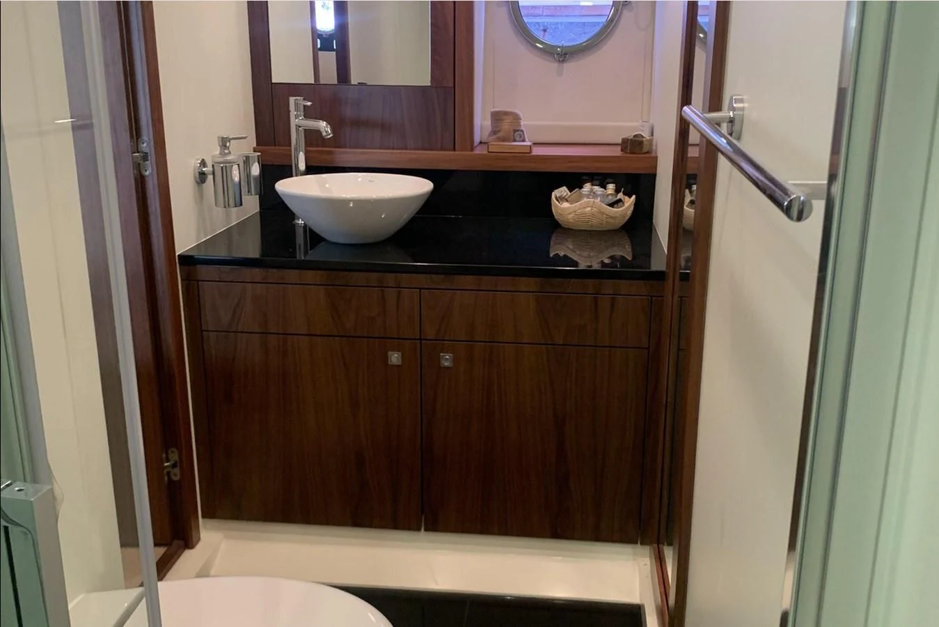 a bathroom with a sink and a mirror aboard MOONLIGHT DRIVE Yacht for Sale