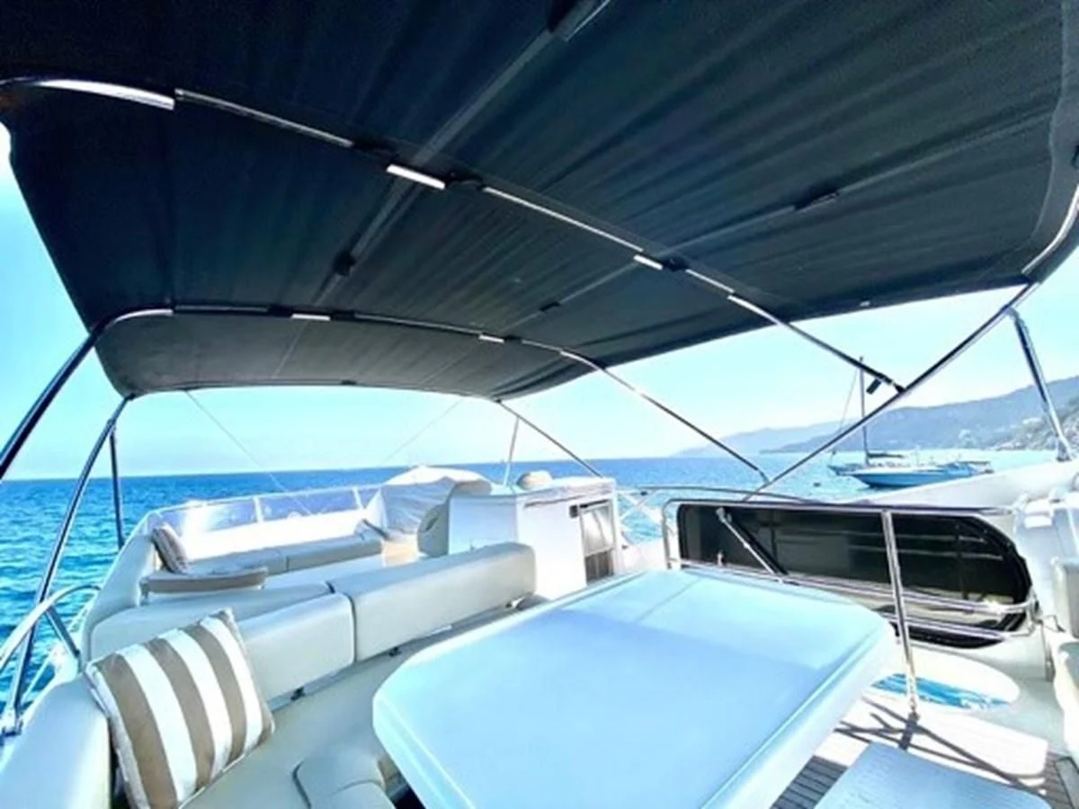 a boat with a blue canopy aboard MOONLIGHT DRIVE Yacht for Sale