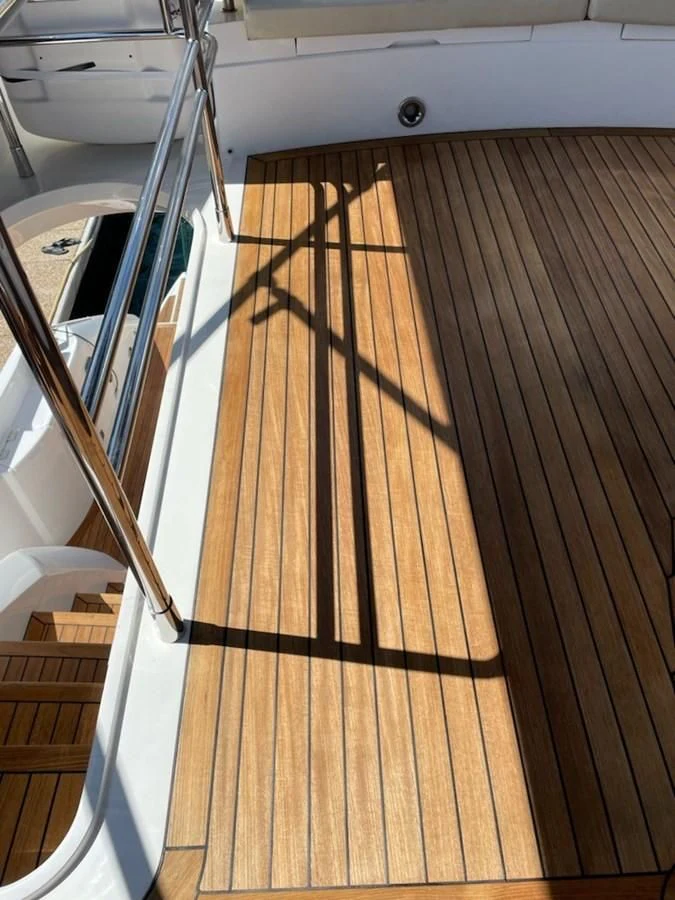 a wooden deck with a railing aboard MOONLIGHT DRIVE Yacht for Sale