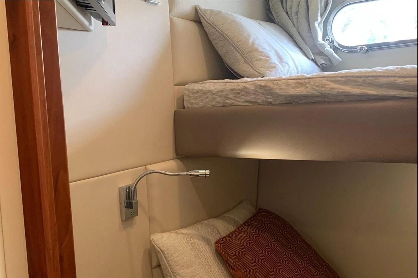 a bed with a white pillow aboard MOONLIGHT DRIVE Yacht for Sale