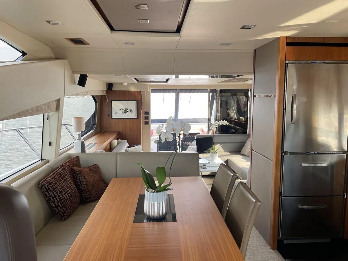 a living room with a table and chairs aboard MOONLIGHT DRIVE Yacht for Sale