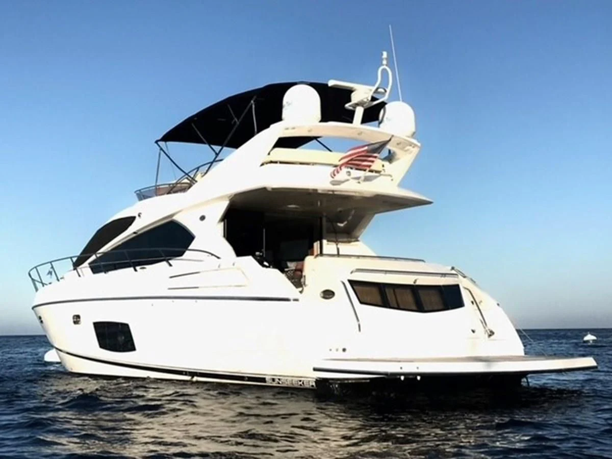 a white yacht on the water aboard MOONLIGHT DRIVE Yacht for Sale