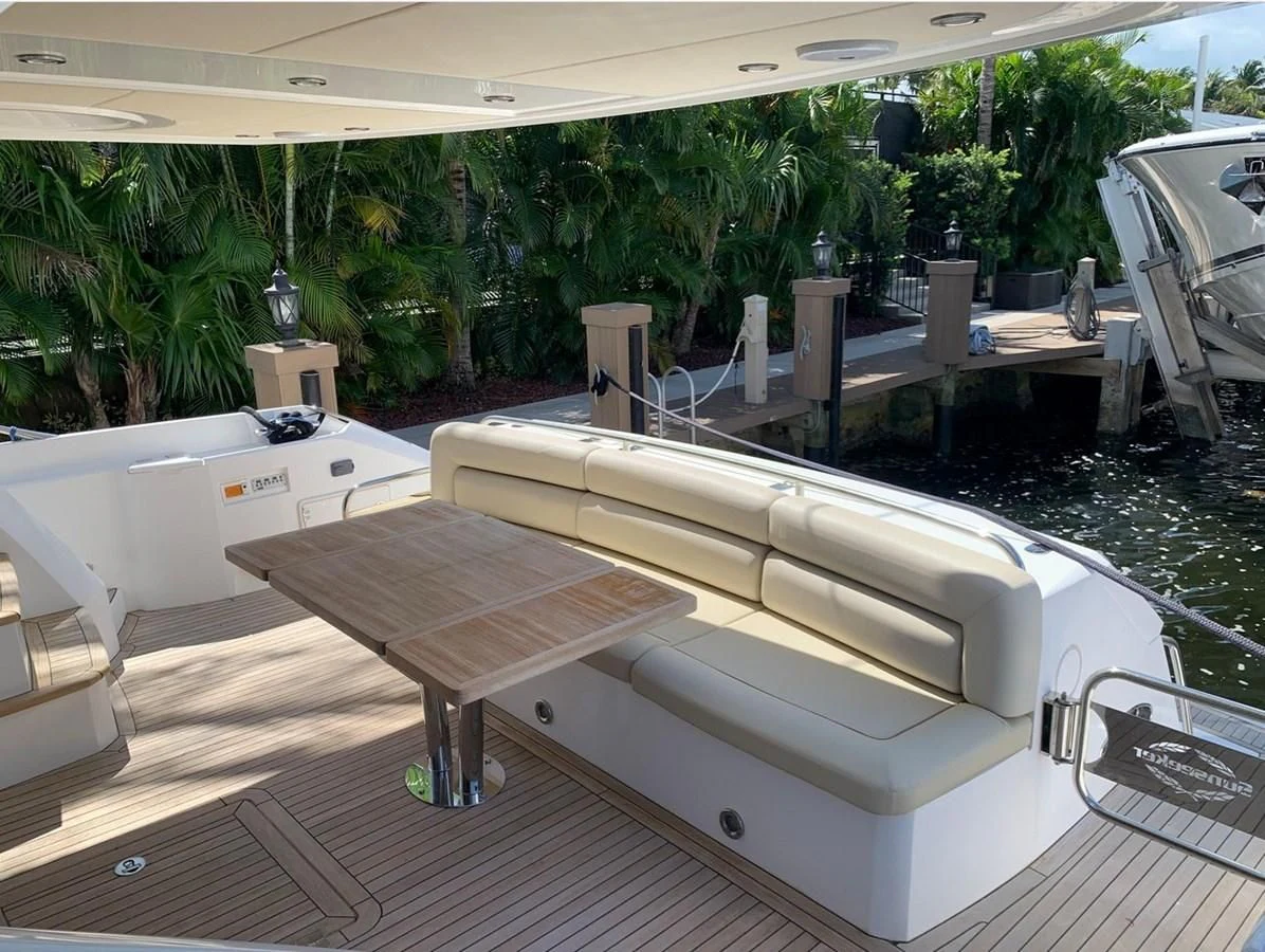 a pool with tables and chairs aboard MOONLIGHT DRIVE Yacht for Sale