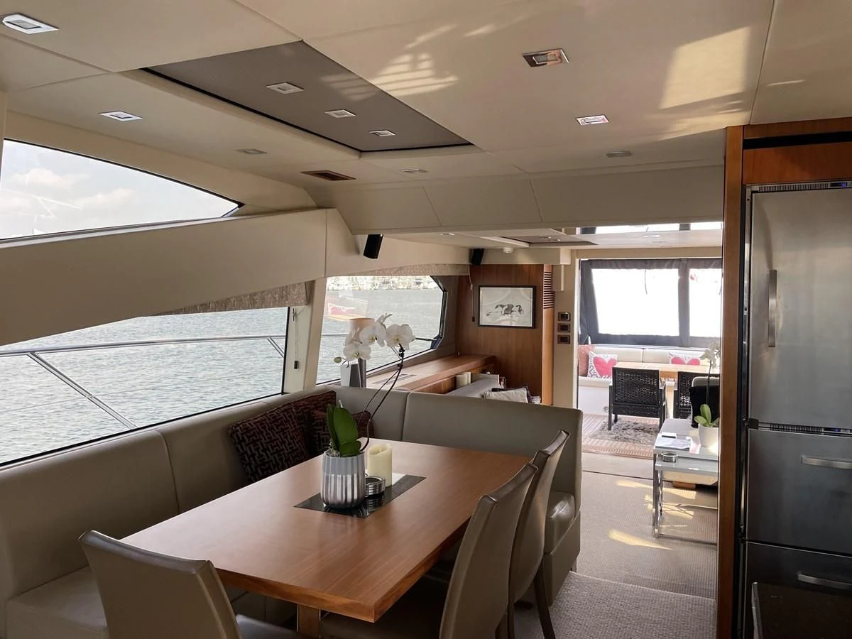 a room with a table and chairs aboard MOONLIGHT DRIVE Yacht for Sale