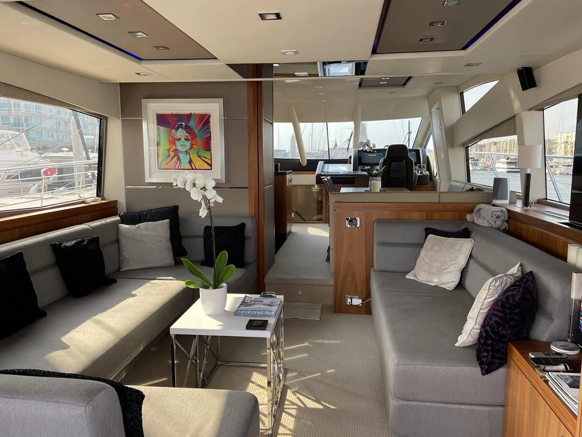 a living room with a couch and a coffee table aboard MOONLIGHT DRIVE Yacht for Sale