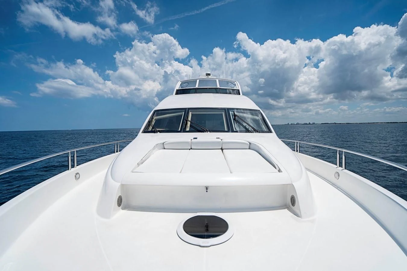 a white car on a boat aboard RENDEZVOUS Yacht for Sale