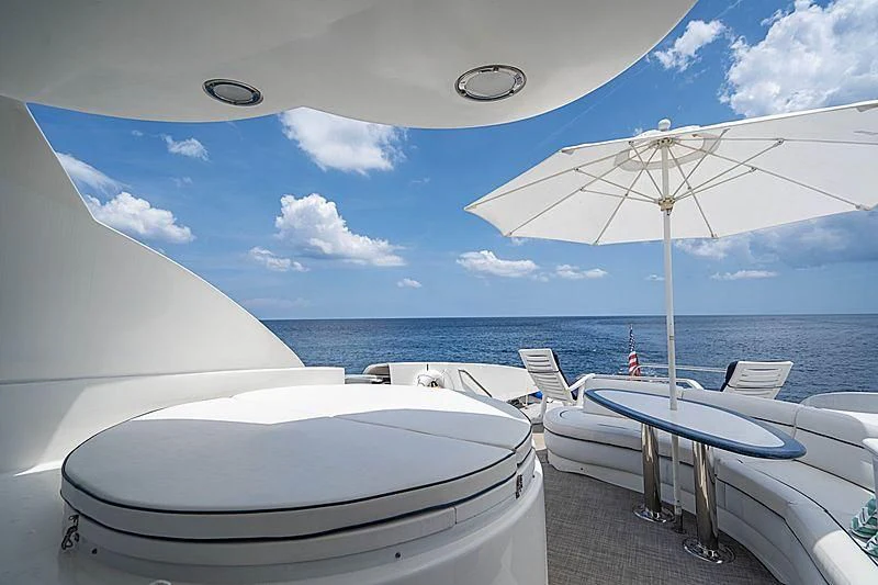 a table and chairs on a beach aboard RENDEZVOUS Yacht for Sale