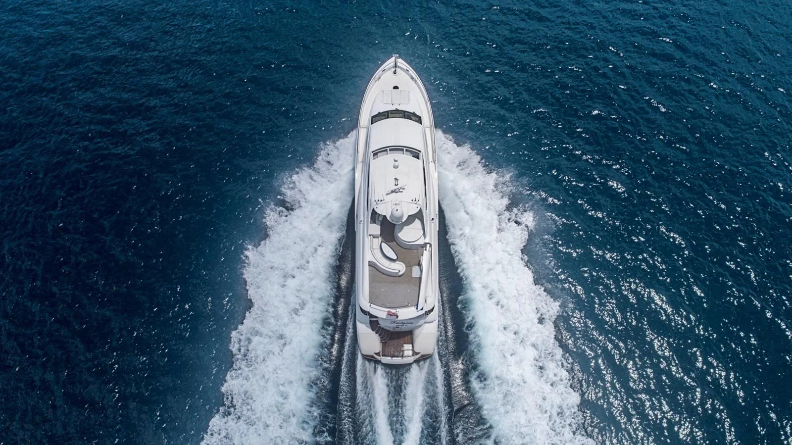 a white car on a road aboard RENDEZVOUS Yacht for Sale