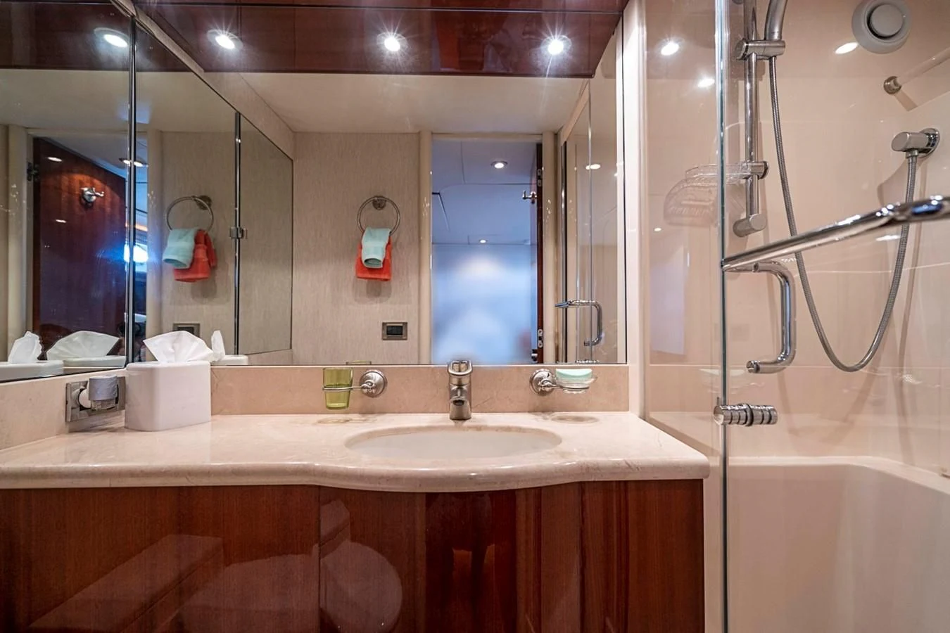 a bathroom with a large mirror aboard RENDEZVOUS Yacht for Sale