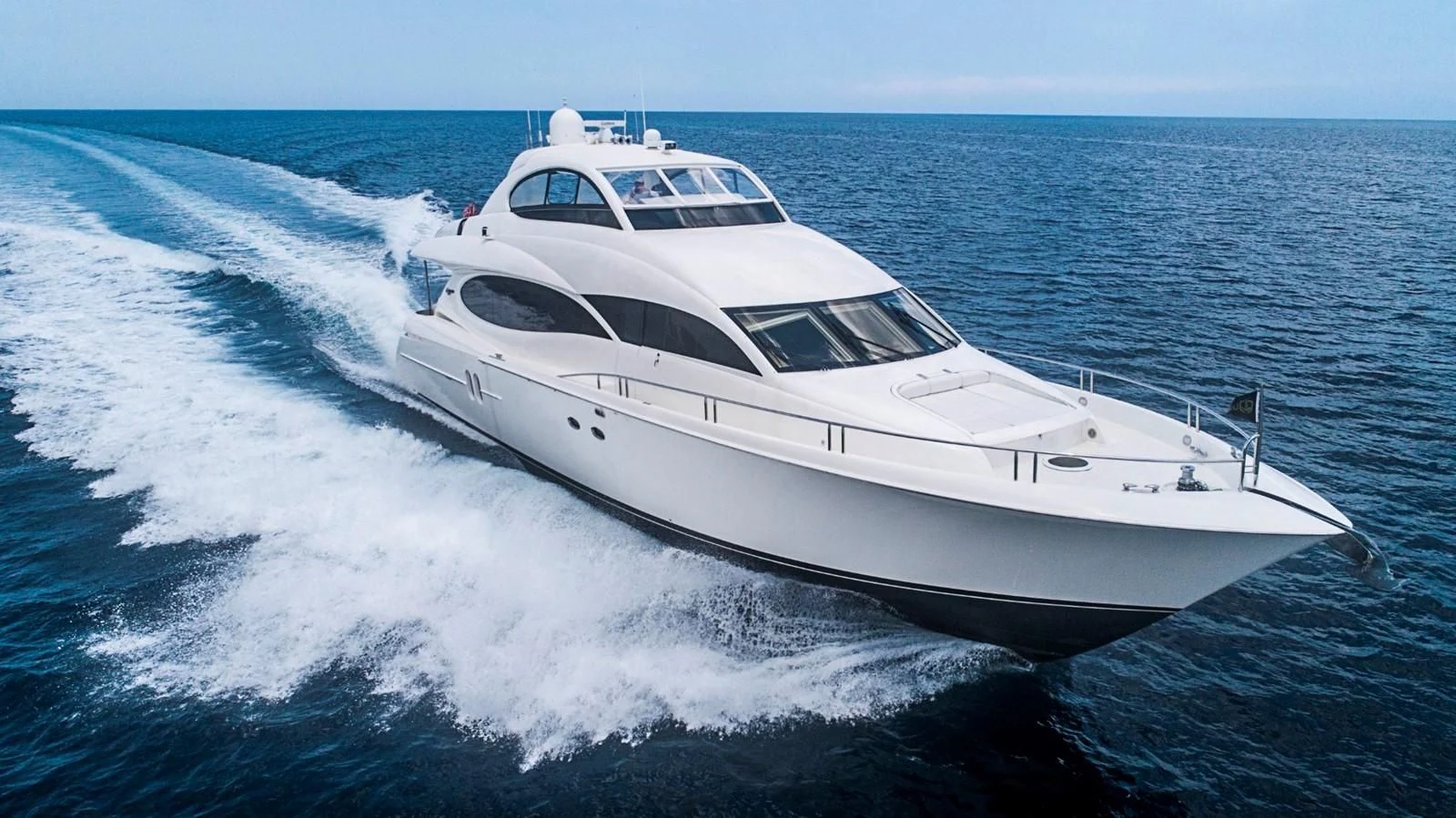 a white yacht on the water aboard RENDEZVOUS Yacht for Sale