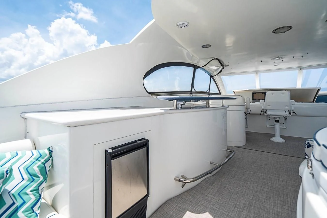 a white car with a large mirror aboard RENDEZVOUS Yacht for Sale