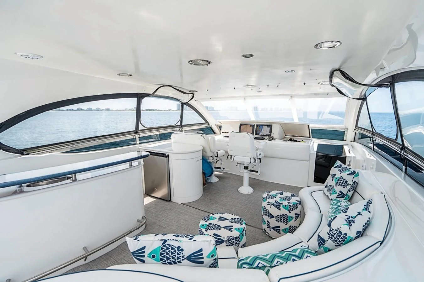 a boat with a large deck aboard RENDEZVOUS Yacht for Sale
