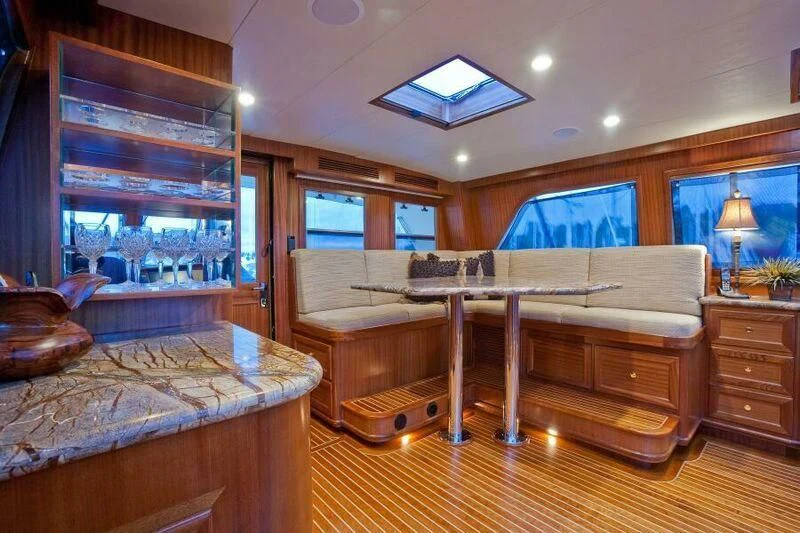 a bedroom with a bed and a desk aboard AL DI LA Yacht for Sale