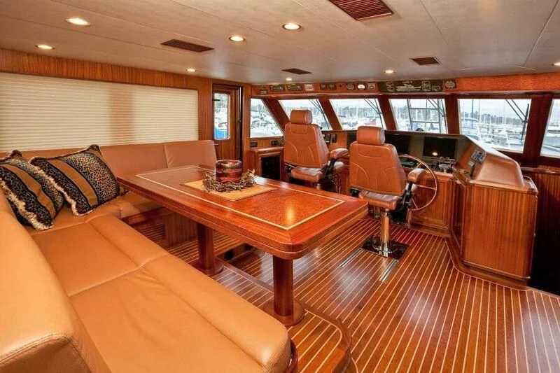a large living room with a table and chairs aboard AL DI LA Yacht for Sale