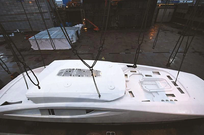 a white boat on a dock aboard BLACK SHARK Yacht for Sale