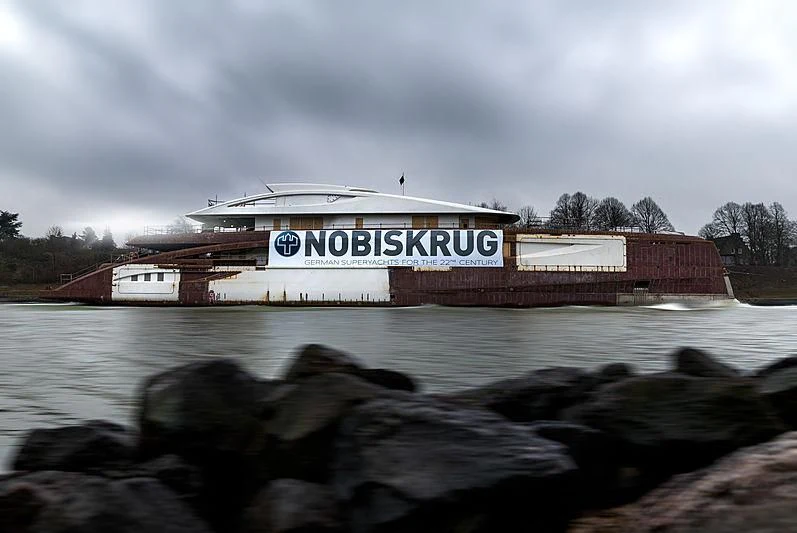 a large boat in a body of water aboard BLACK SHARK Yacht for Sale